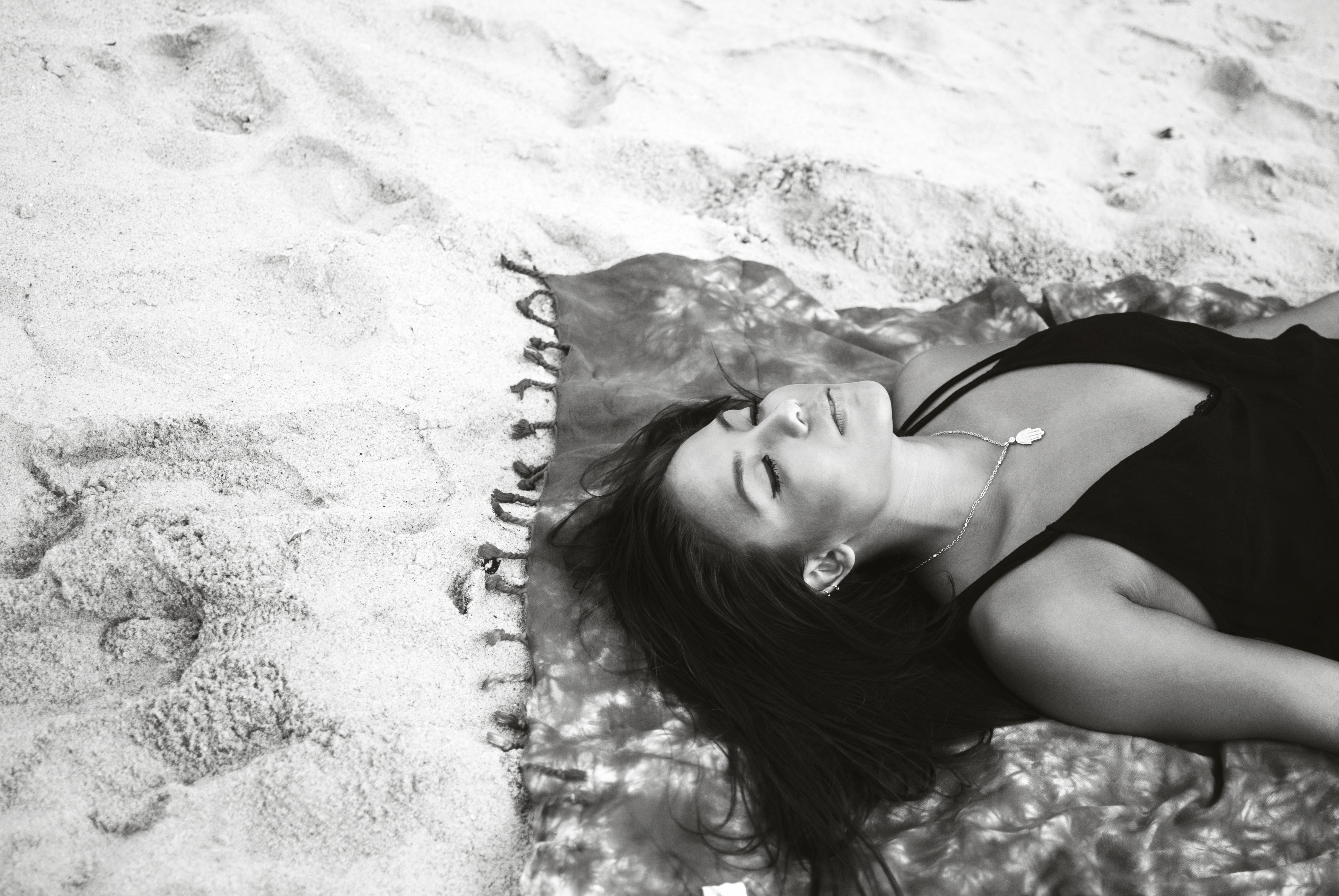 Lady lying on beach towel