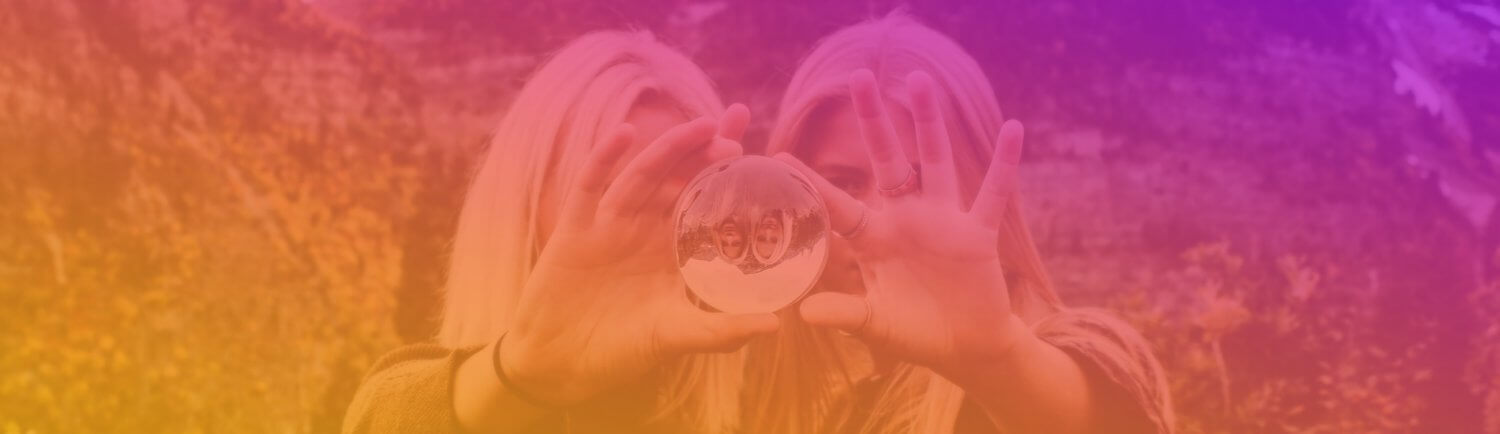 2 woman holding a lens ball