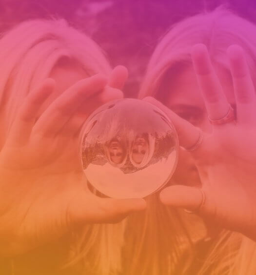 2 woman holding a lens ball