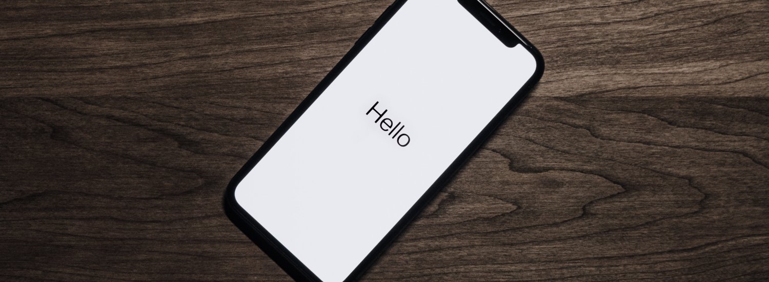iPhone with hello on screen
